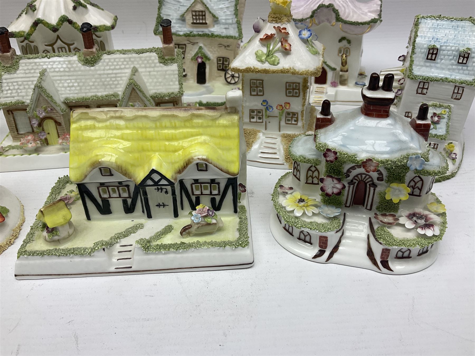 Eleven Coalport cottages, including Park Folly, The Alms House, Watermill and The Summer House, each with printed marks beneath