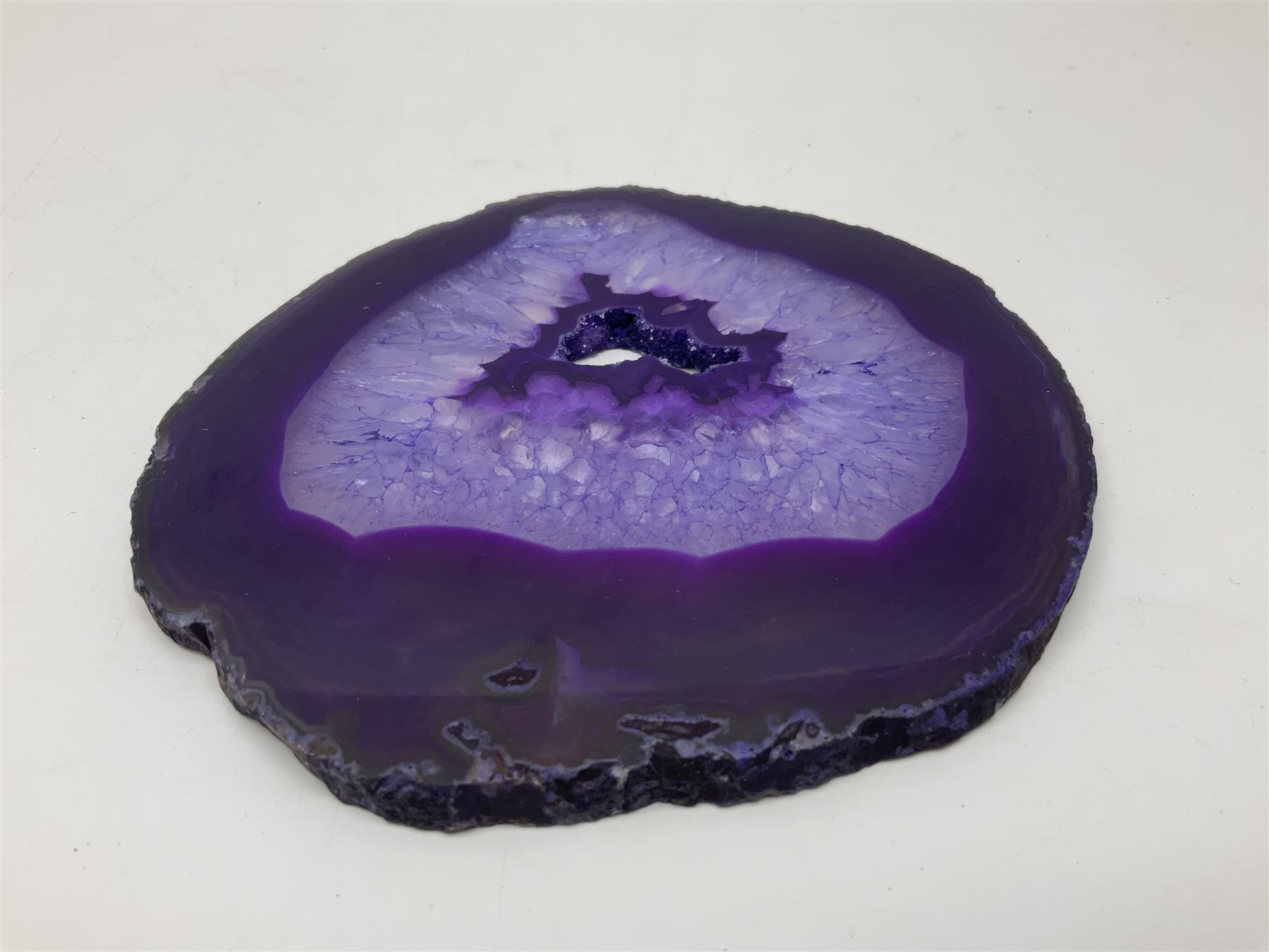Pair of purple agate slices, polished with rough edges, raised upon gilt metal stands