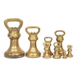Graduating set of brass bell weights