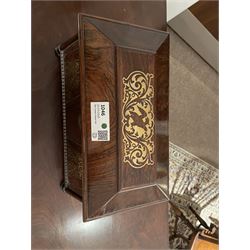 Early 19th century rosewood and brass inlaid tea caddy, of sarcophagus form, the front and hinged opening cover inlaid with brass scrolling panels, opening to reveal a compartmented interior with twin removable boxes with conforming inlaid brass detail to the hinged covers and zinc lining to the interiors, flanking a later glass mixing bowl, the whole upon four turned cylindrical feet, H21cm W36cm D20cm