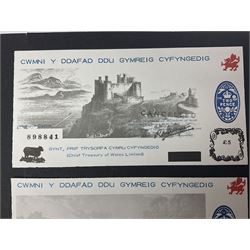 Six ‘The Welsh Black Sheep Company’ notes comprising Cardiff Castle ten pound, five pound, one pound, ten shillings, five shillings featuring modified Prince of Wales feather and fifty new pence note stamped ‘First February 1971 Stamp Duty abolished’, with both black and red cancellations, housed in plastic sleeves