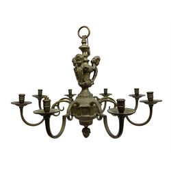 20th century heavy brass eight branch electrolier, detailed with putti masks, approximately H60cm W71cm