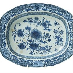 18th century Chinese oval dish shallow dish decorated with flowers in blue and white within a scroll and key pattern border W37cm and a Chinese blue and white charger D34cm (2)