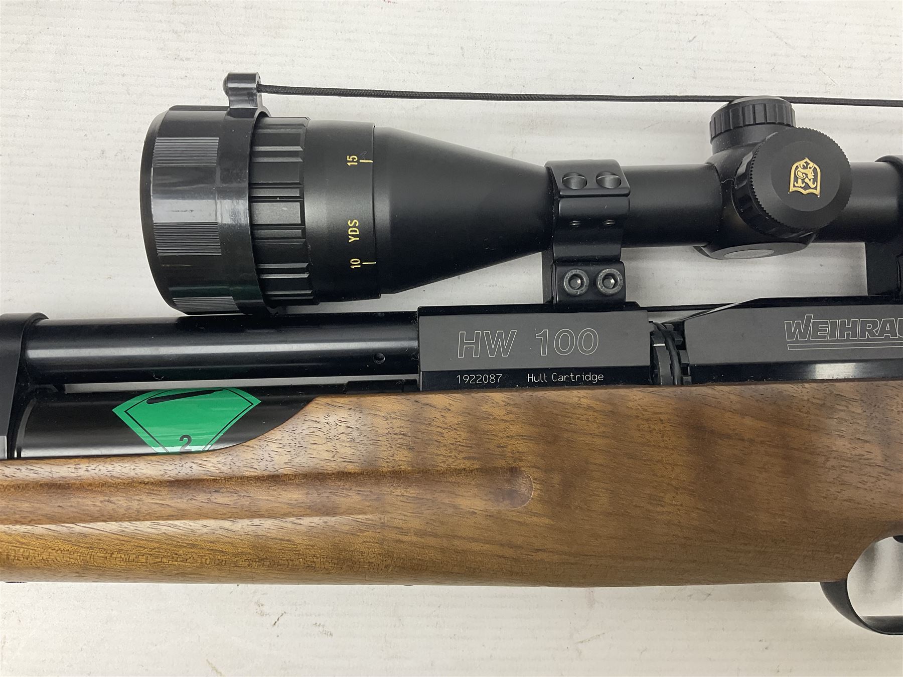 Weihrauch Sport HW100 .177 calibre PCP repeating air rifle; walnut thumbhole stock with textured pistol-grip; fourteen-shot magazine; Nikko Stirling Gameking 3.5 -10x44 illuminated telescopic sight; No.1922087 L90cm overall; in Napier fleece lined gun sling; with re-filling air tank and quantity of pellets NB: AGE RESTRICTIONS APPLY TO THE PURCHASE OF AIR WEAPONS.