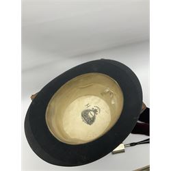 Gentlemen's black brushed silk top hat by Henry Heath of London housed in a leather case with dark red velvet interior, along with a 'Mcdonald' rotary hat iron patented 1892