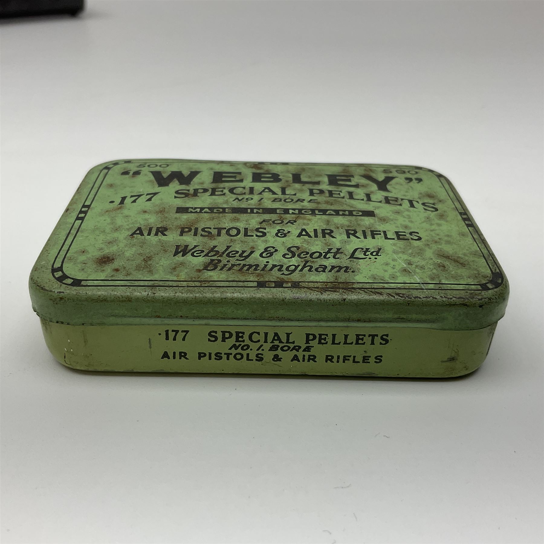 Webley 'Junior' .177 air pistol with top lever action and wooden grips; marked The Webley Junior .177 Webley & Scott Ltd Birmingham 4 Made in England to left side of cylinder; numbered 078 to muzzle and J3007 to trigger guard; L21cm; together with part tin of Webley .177 Special Pellets NB: AGE RESTRICTIONS APPLY TO THE PURCHASE OF THIS LOT.