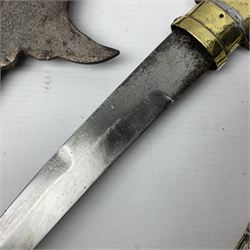 Moroccan jambiya dagger with 24.5cm plain curved blade stamped LONDON to the ricasso area, the hilt and scabbard overlaid with plain sheet brass to the back and ornate silver coloured metal to the front; waisted grip and arched pommel; two pyramid mounts to the scabbard L41cm overall; large billhook with curving blade and stacked leather washer grip; and a reproduction halberd blade (3)