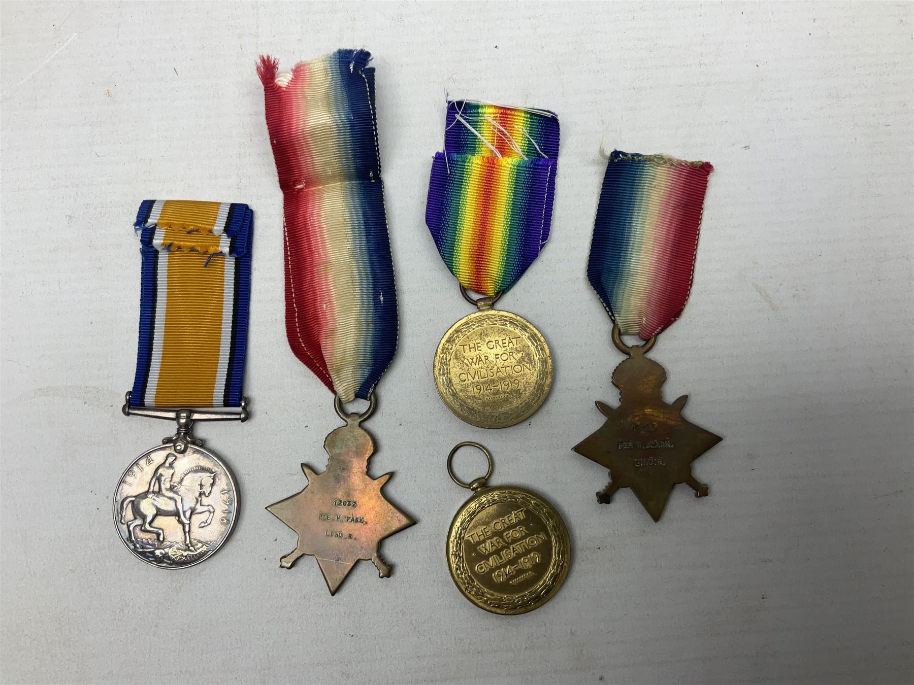 Five WW1 Lincolnshire Regiment medals comprising 1914-15 Star awarded to 12032 Pte. H. Pask; 1914-15 Star to 10759 Pte. W. Clark; British War Medal to 7739 A. Sjt. G.W.L. Atkin; Victory Medal to 22678 Cpl. H. Vallance; all with ribbons; and Victory Medal to 6014 Pte. W.S. Boulton; some biographical details (5)