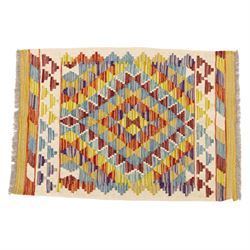 Two Chobi flatweave kilims with a repeating stepped diamond medallion design in live green, rust, teal, purple, and ivory, framed by chevron and geometric borders, 121x80cm & 87x60cm 