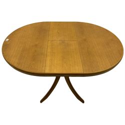 Light oak circular extending dining table and four chairs 