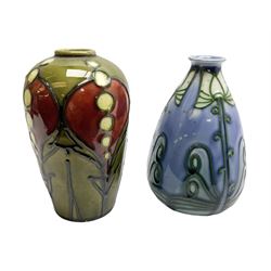 Minton Secessionist vase, with tube-lined stylised flower head decoration on a blue ground, printed mark to base 'Minton Ltd, No. 30', together with another Minton Secessionist tubelined vase,  printed mark to base 'Minton Ltd, No. 16', tallest example H13.5cm