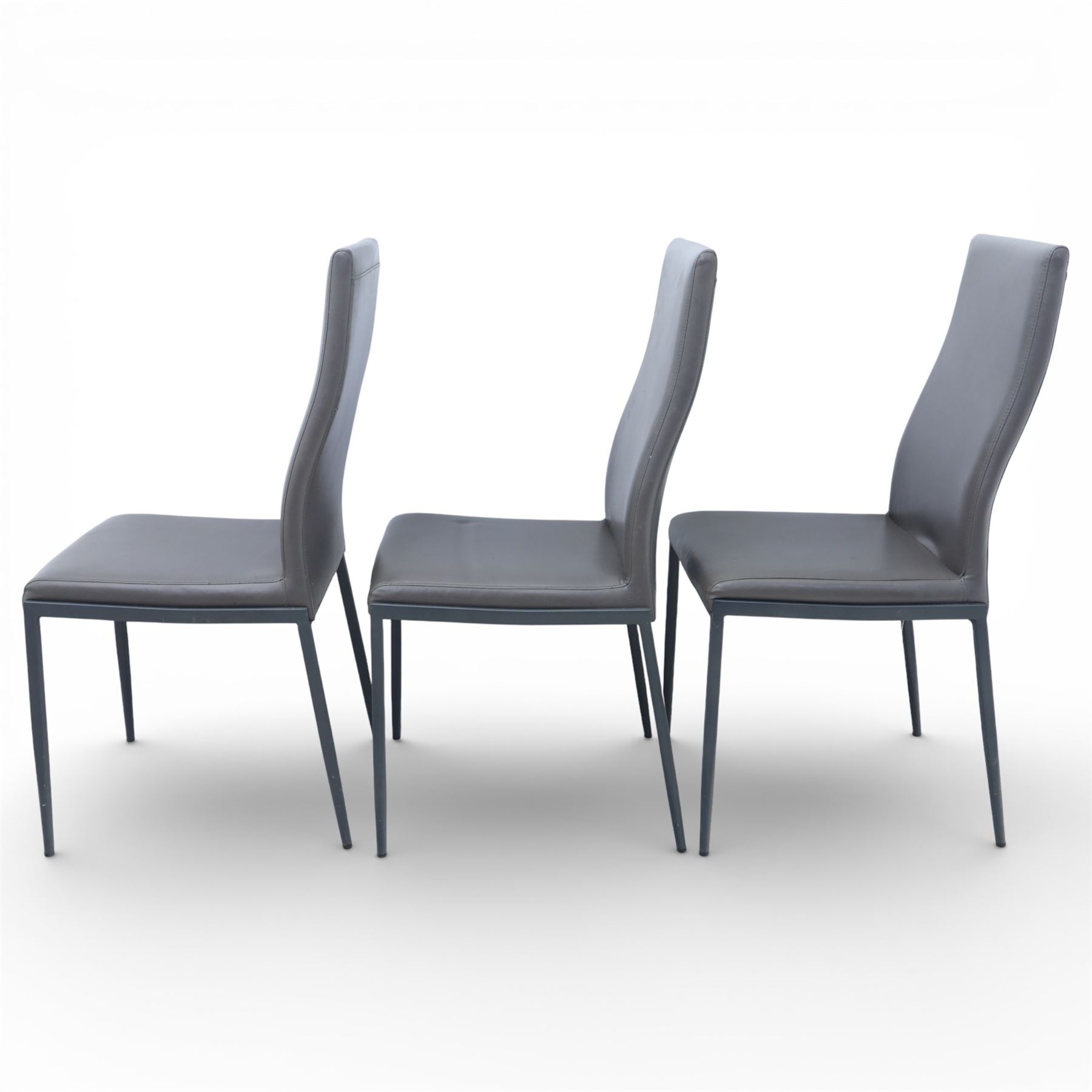 Modern composite marble effect dining table, rectangular top with simulated veining supported on a block pedestal base, accompanied by six matching dining chairs with padded seats and backs in grey upholstery on slim metal legs