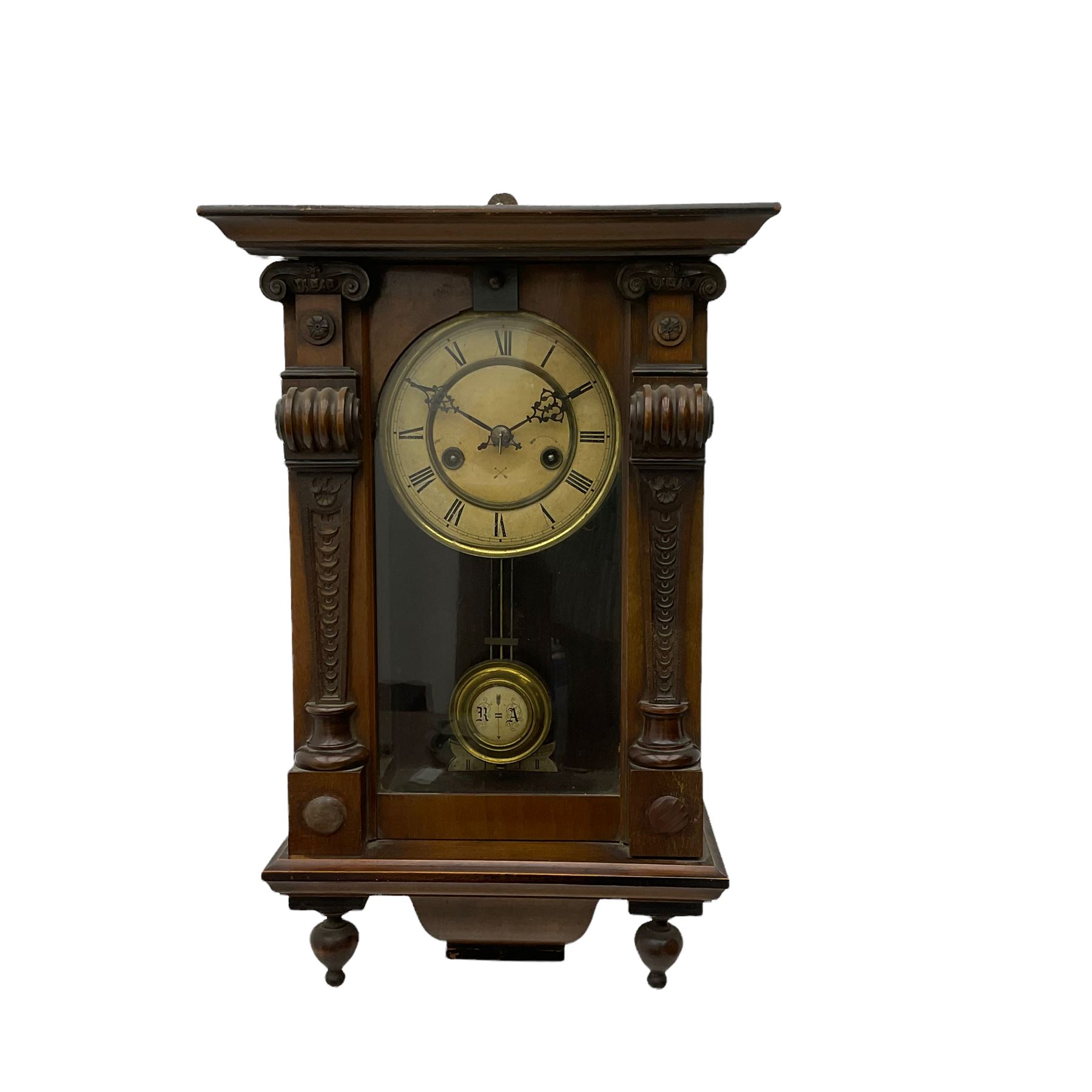 A German HAC wall clock with an eight-day spring driven movement, striking the hours on a gong, with a two-part ivorine dial and pierced gothic hands, gridiron pendulum with beat plate. 

