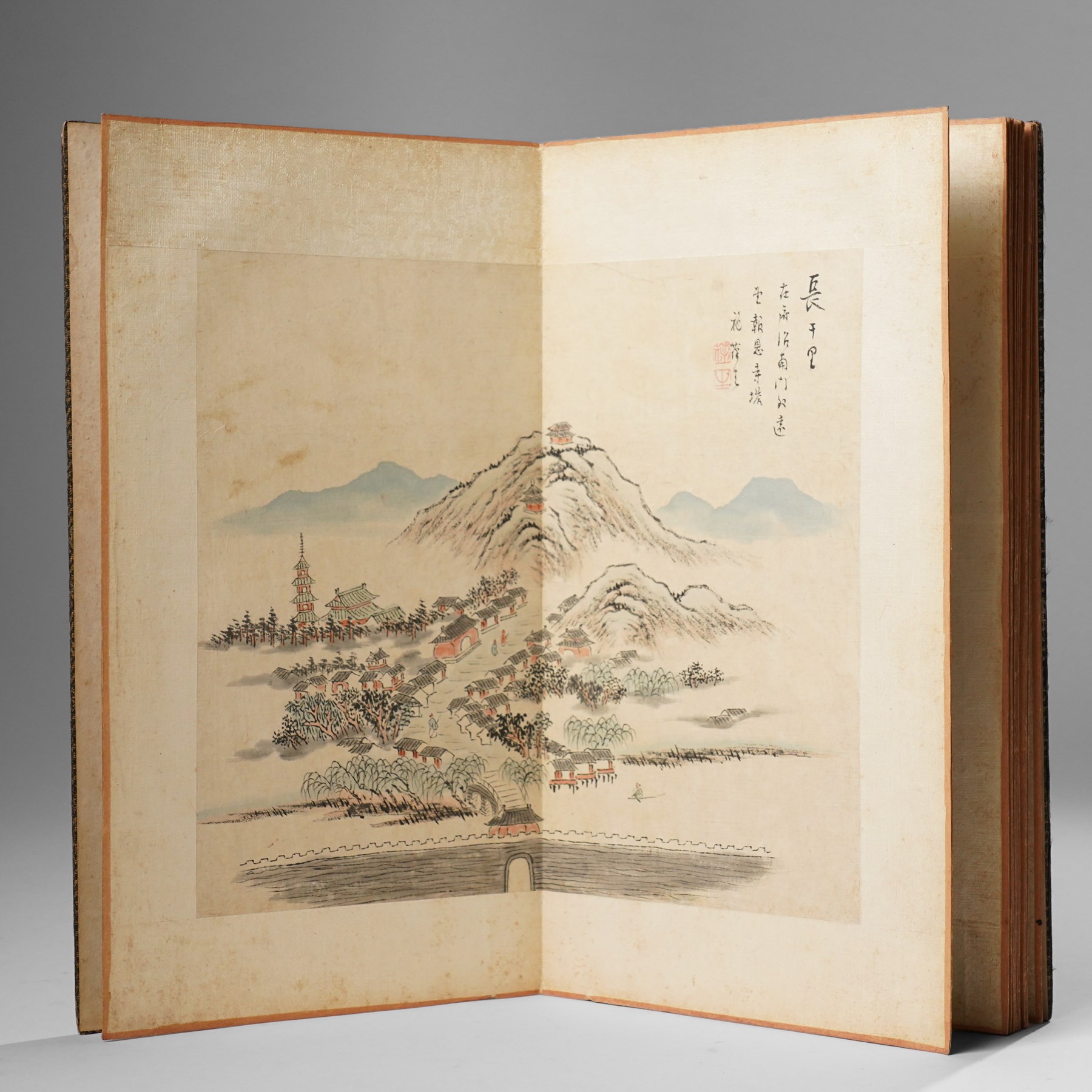 Chinese fold out book, comprising 12 hand-coloured woodblock landscapes each bearing inscription and artists seal  
