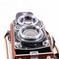 Rolleiflex Franke & Heidecke DBP DBGM 2.8 F TLR camera serial no. 2439093, with a Heidosmat 1:2.8/80 lens serial no. 894062 and a Carl Zeiss Planer 1:2.8 f=80mm lens serial no. 4092068, in leather case with instruction booklet