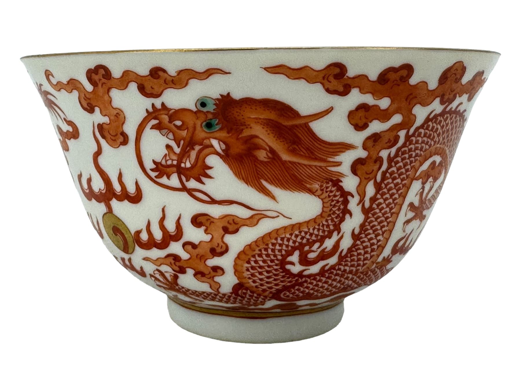 Chinese porcelain iron red tea bowl, the exterior painted with two five claw dragons chasing the flaming pearl, amidst clouds, red Quinlong seal mark beneath, D10.5cm x H6.5cm