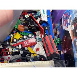 Lego - large quantity of part-built models and loose component parts including Lego Technic and Lego System, space and road vehicles, ships and boats, helicopter etc; together with two set boxes and folder  containing large quantity of instruction booklets; stored in two very large plastic boxes