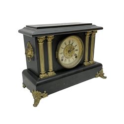 Seth Thomas - American 8-day late 19th century faux slate mantle clock, wooden case with a flat top, decorative gilt metal columns, lion heads and splayed feet,  two part dial with a gilt centre and Roman numerals to the chapter, within an ornate glazed bezel, twin train spring driven movement striking the hours on a coiled gong and the half hours on a bell. 