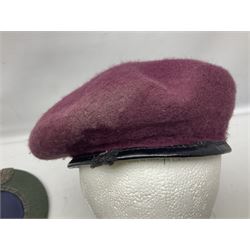 Four paratrooper berets - Russian, Italian, British and Foreign Legion; all with badges (4)