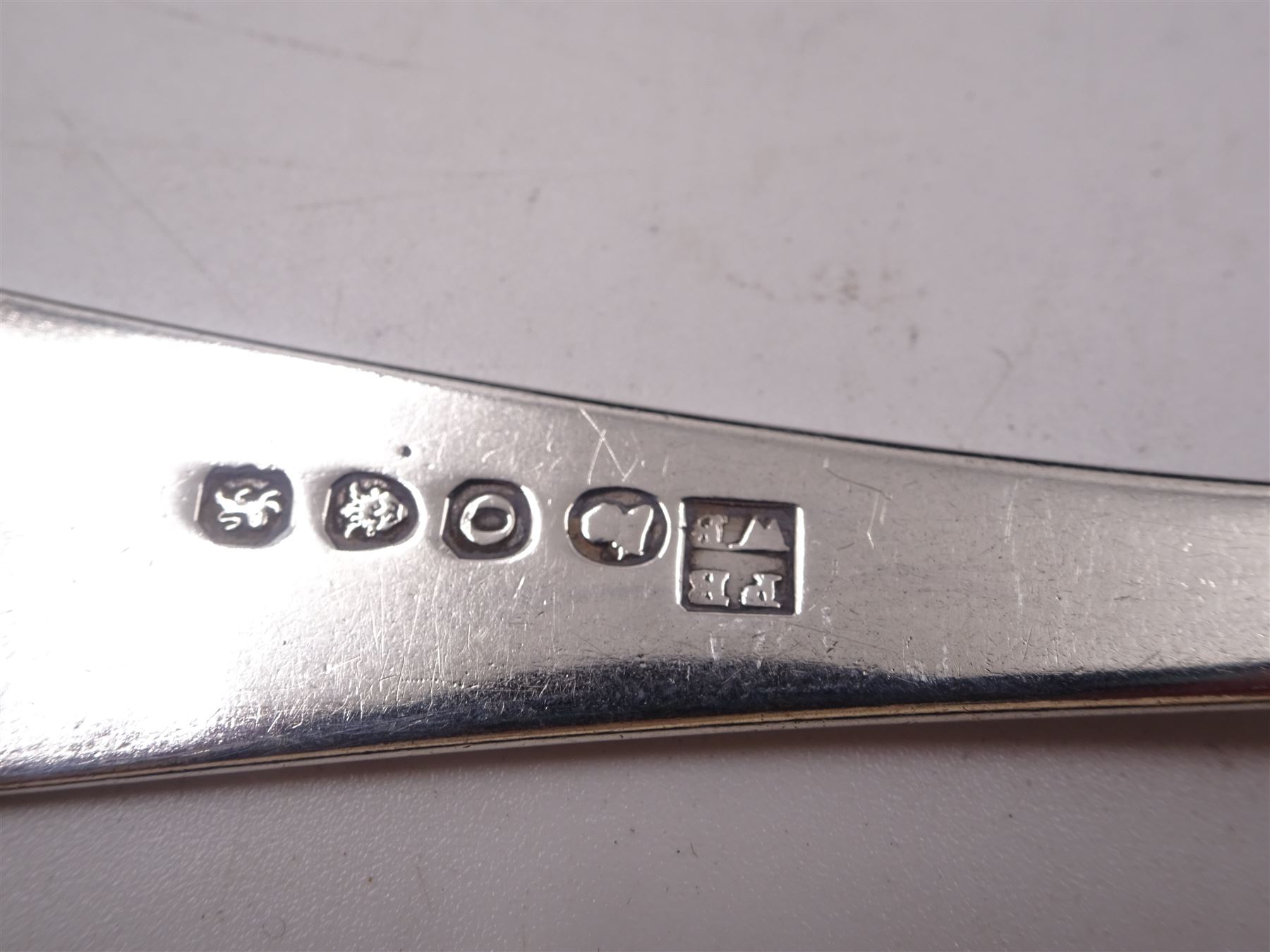 Set of five George III Newcastle silver Old English pattern teaspoons, with engraved initials and pinprick decoration, hallmarked Christian Ker Reid, Newcastle, no date letter, together with a George III silver Old English pattern sauce ladle, engraved with initial to terminal, hallmarked Peter & William Bateman, London 1809