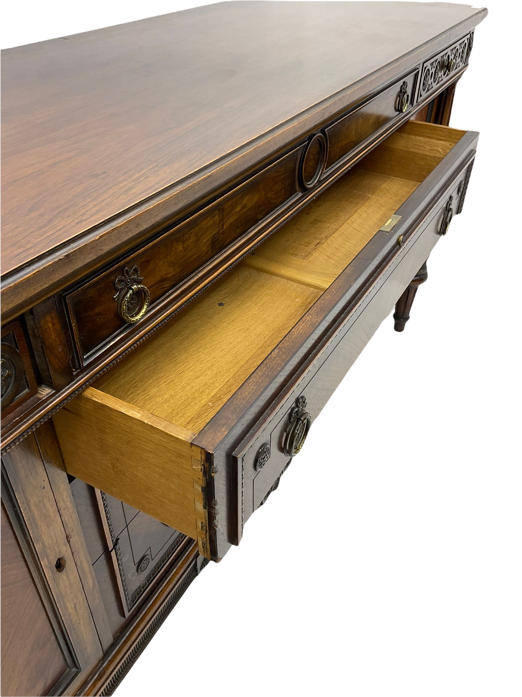 Early 20th century French walnut sideboard, fitted with six drawers and two cupboards