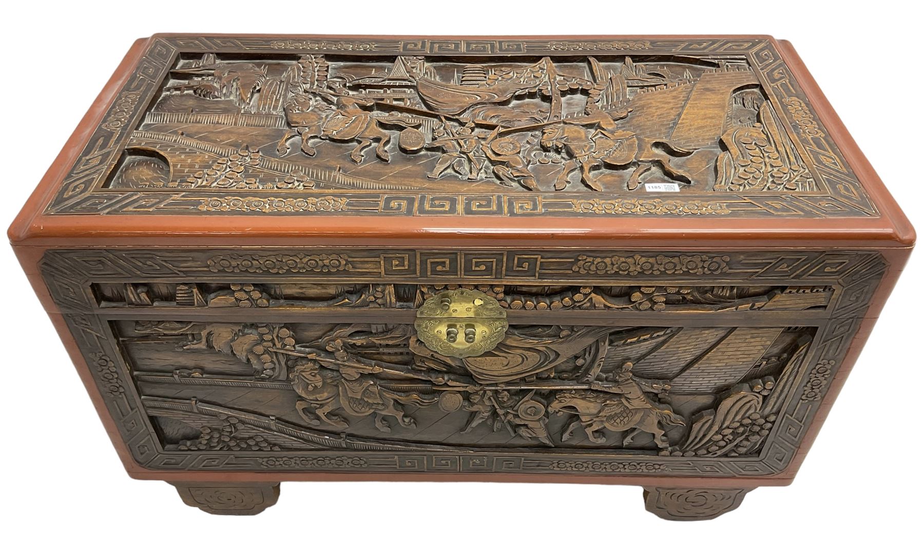 Mid-20th century Singapore camphor wood blanket chest, heavily carved depicting battle scenes and cityscapes 