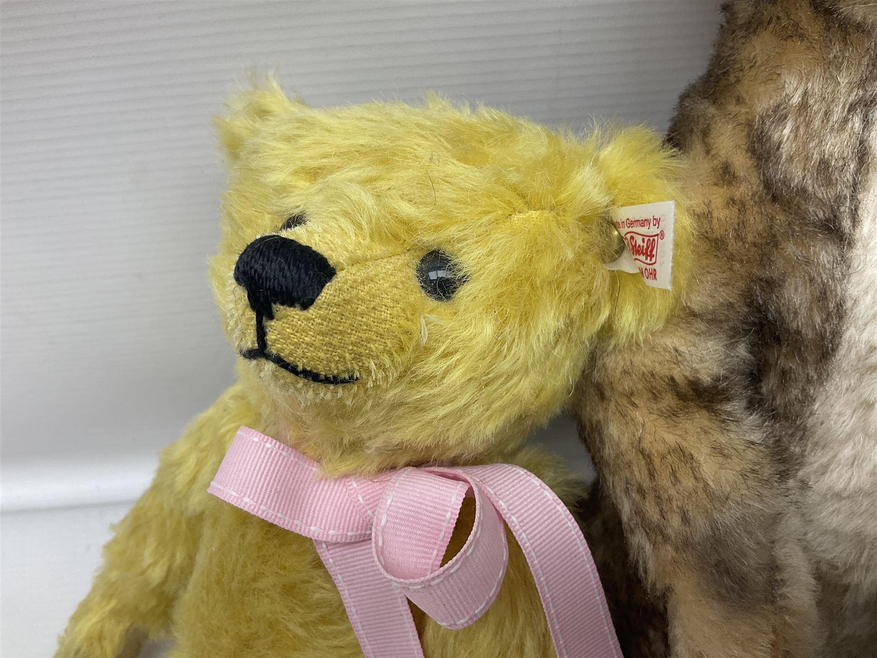 Seven modern Steiff teddy bears comprising two limited edition '1908 Paul the Growler' bears Nos.1124/3000 and 1310/3000; 028649 Classic Teddybear 23; 005992 Classic Teddybear 28 (black); 071249 Mungo Meerkat 30; 079139 Reclining dog for American Kennel Club; and 029561 Petsy gespitzt (1928) 16cm; together with a Mrs. McCatty's limited edition 2156 Sophie bear No.1557/1750; all unboxed but most with labels (8)