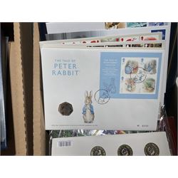 Approximately one hundred and fifteen Royal Mint coin covers, in two ring binder folders and loose, together with approximately 53 grams of Great British pre-1920 and approximately 68 grams of Great British pre-1947 silver threepence coins, and a small quantity of further pre-decimal coins