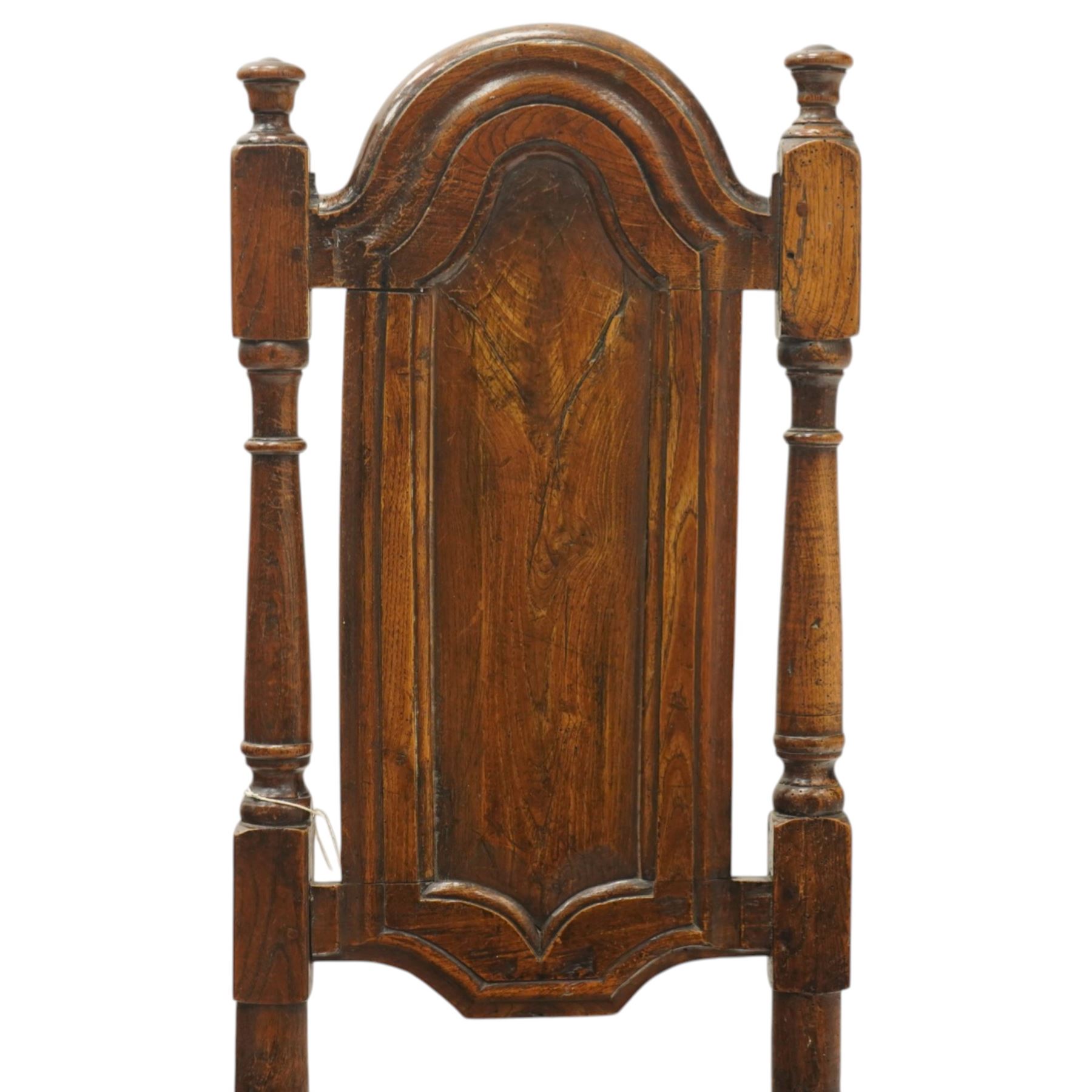 17th century oak and elm hall chair, the high-back with shield-shaped fielded panelling flanked by turned uprights, over a panelled seat, raised on turned supports united by H-stretcher with moulded serpentine front-stretcher