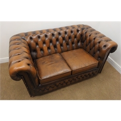  Chesterfield two seat sofa upholstered in deep buttoned brown leather, W150cm  