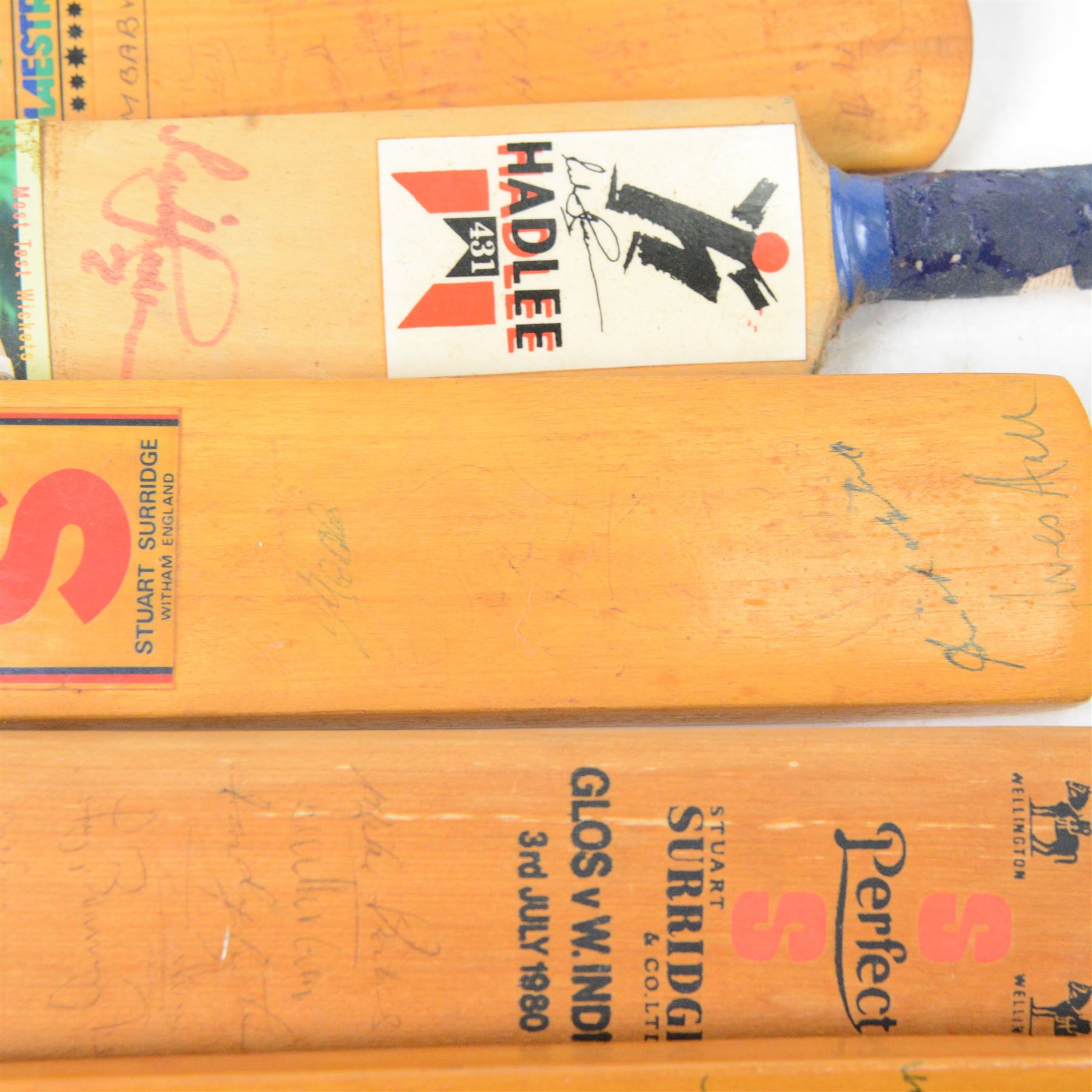 Signed International cricket memorabilia, comprising Alan Donald signed Kookaburra Commander cricket ball, wide brimmed hat signed by Darren Sammy and other West Indies players and a collection of signed miniature cricket bats, each with signatures of International cricket players including Brian Lara, Grant Flower, Richard Hadlee, Zimbabwe vs Rest of World 1993, South Africa vs Presidents VI 1994, Eastern Province South Africa 1992 and South Africa Touring Side Scarborough 1994