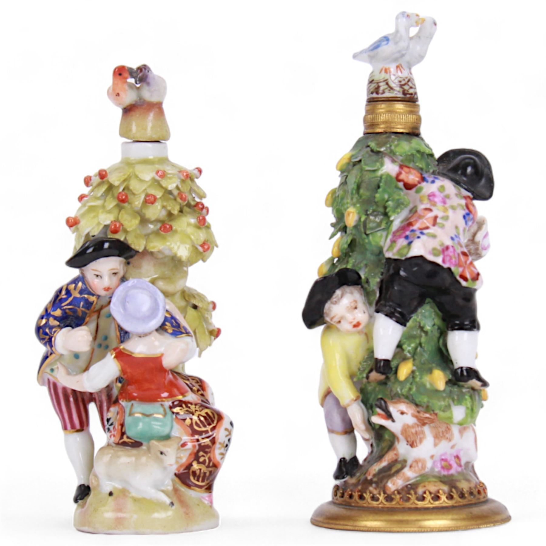 Sitzendorf perfume bottle, modelled as lovers around a tree, together with another continental perfume bottle of similar design, H11cm 