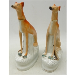  Pair of Victorian Staffordshire seated Greyhounds with dead game, H32cm   