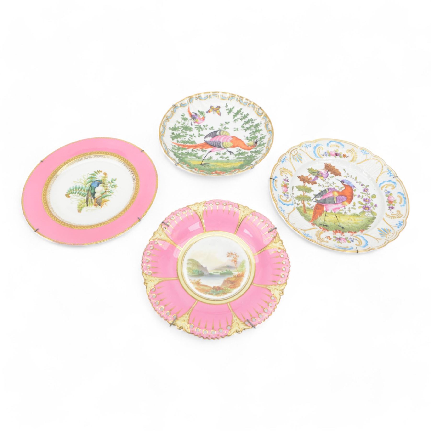 Two 19th century Samson porcelain plates, decorated in the Chelsea style with exotic birds, flowers and insects, each with spurious gold anchor mark verso, largest example D24cm, together with a 19th century dessert plate, possibly Worcester, hand painted with a hummingbird, within a gilt band and pink border, D22.5cm, and a further 19th century dessert plate with shaped and pierced rim, hand painted with a view of Loch Lomond and titled verso, D22cm, (4)