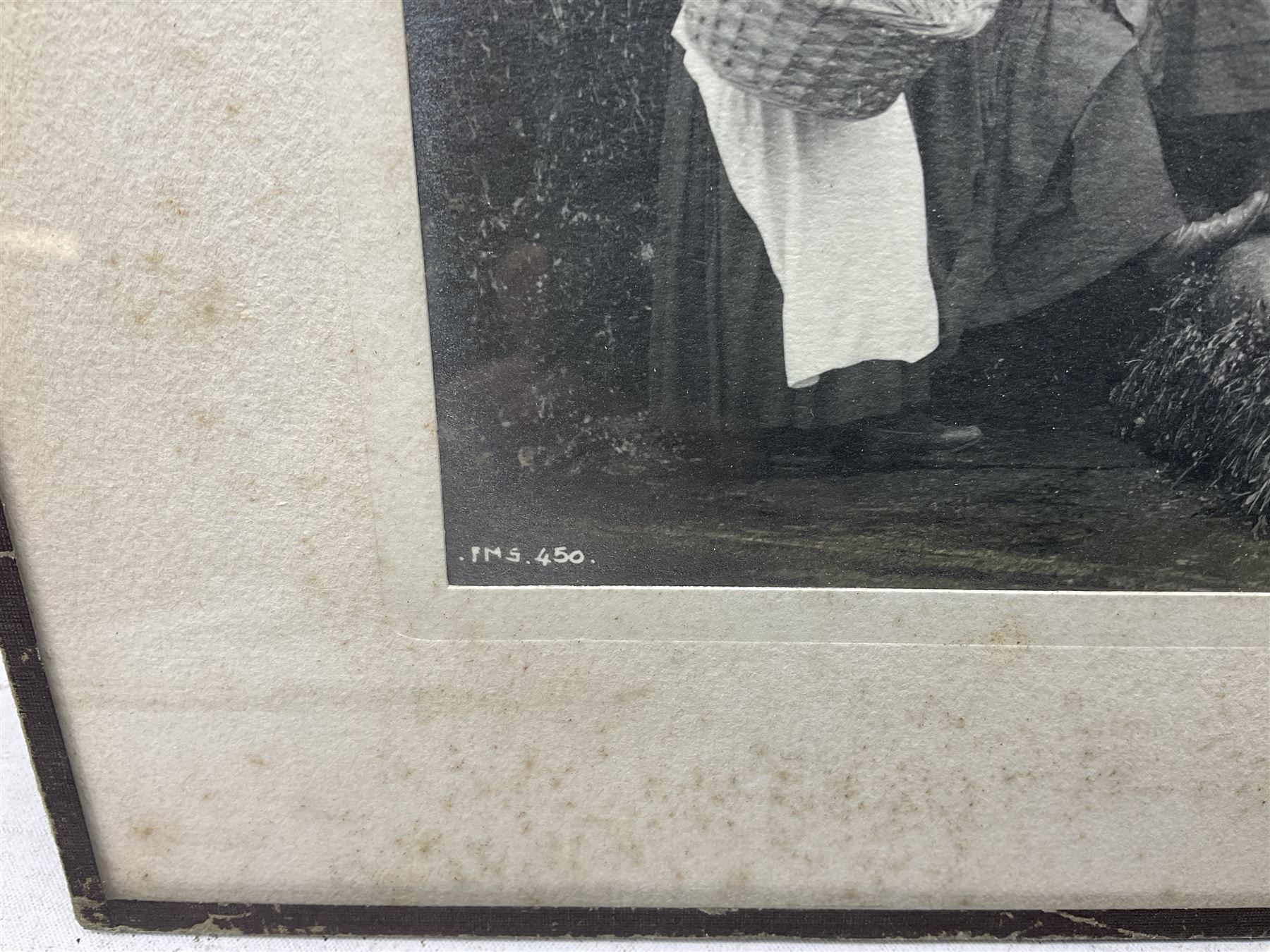 Frank Meadow Sutcliffe (British 1853-1941): Eight Fishergirls at the Foot of Whitby East Pier (E-6C), photograph signed in pencil, initialled and numbered FMS 450 in the image, original  FM Sutcliffe Whitby label verso 14cm x 19cm