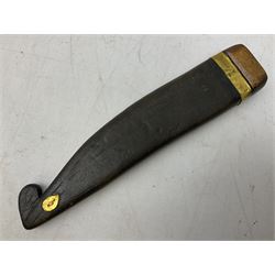 19th century Singhalese knife pia kaetta, the 20cm steel blade inset with yellow and white metal, with metal mounted carved pistol grip, in plain wooden scabbard L33cm overall