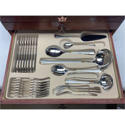 Waltmann und Sohn part canteen of stainless steel and gilt cutlery, the stained wood case with hinged lid above two fitted drawers, L48cm