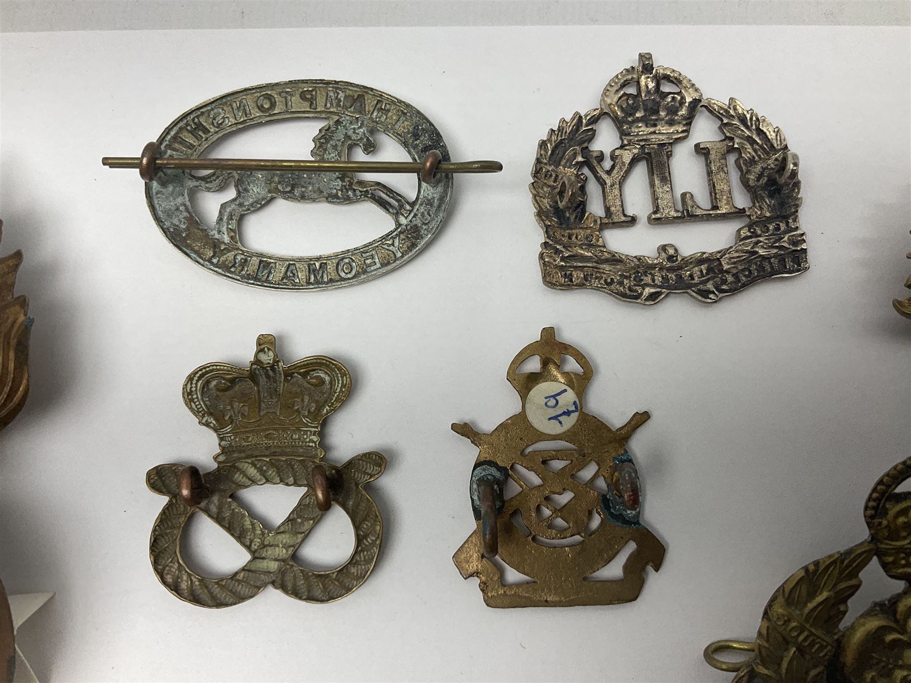 Nineteen Yeomanry metal cap badges including Derbyshire, Northamptonshire, Essex, Glamorgan, Staffordshire, City of London, Surrey, Shropshire, Hertfordshire etc; together with eleven Fusiliers badges including Lancashire, Royal Welch, Northumberland etc (30)