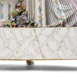 Large19th century  German porcelain mantel clock with white dial and striking movement, the case with a standing figure of Flora resting on a pillar with floral applied decoration, the base painted eith landscape and floral panels on paw feet H77cm W43cm