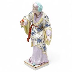 Pair of Continental polychrome Chinese male and female standing figures wearing floral robes H42cm