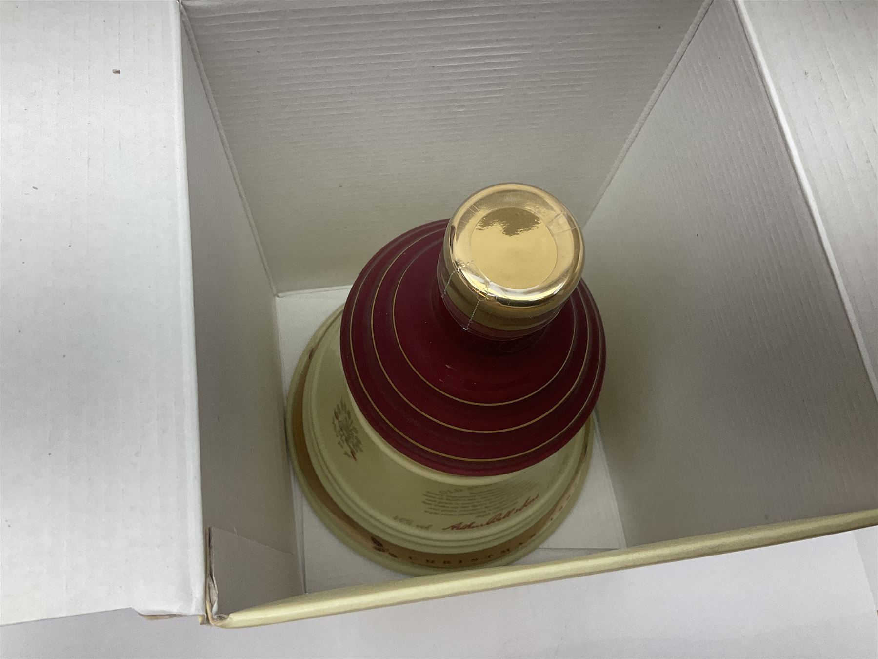 Dimple 15 Year Old Blended Scotch Whisky, together with nine Bells, scotch whisky, in Wade ceramic decanters, including Christmas 1991, 1998, 1996 etc, of various contents and proof 