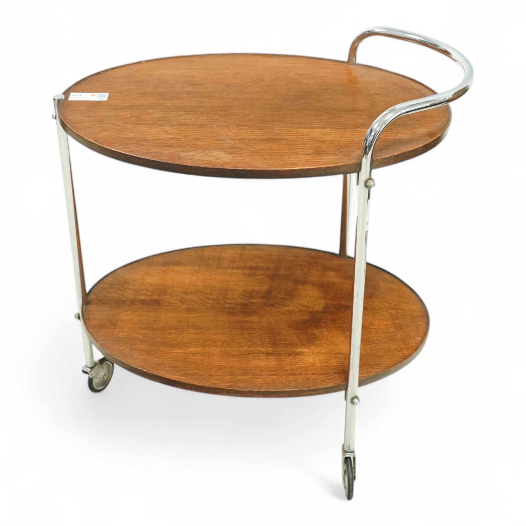 Mid-century oak and chromed metal drinks trolley, twin tiered oval form with rounded edges, chromed tubular supports with integrated handle 