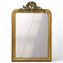 Louis XVI style gilt overmantel mirror, arched rectangular form with moulded frame, surmounted by a pediment carved with ribbon-tied grapevine and leaf decoration, enclosing a plain mirror plate, circa 1900