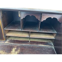 George III mahogany bureau, the conch inlaid fall front enclosing pigeon holes, shelves and central cupboard with inlaid flower motif, four graduating cock-beaded drawers below each with brass handles, lower moulded edge over shaped bracket feet