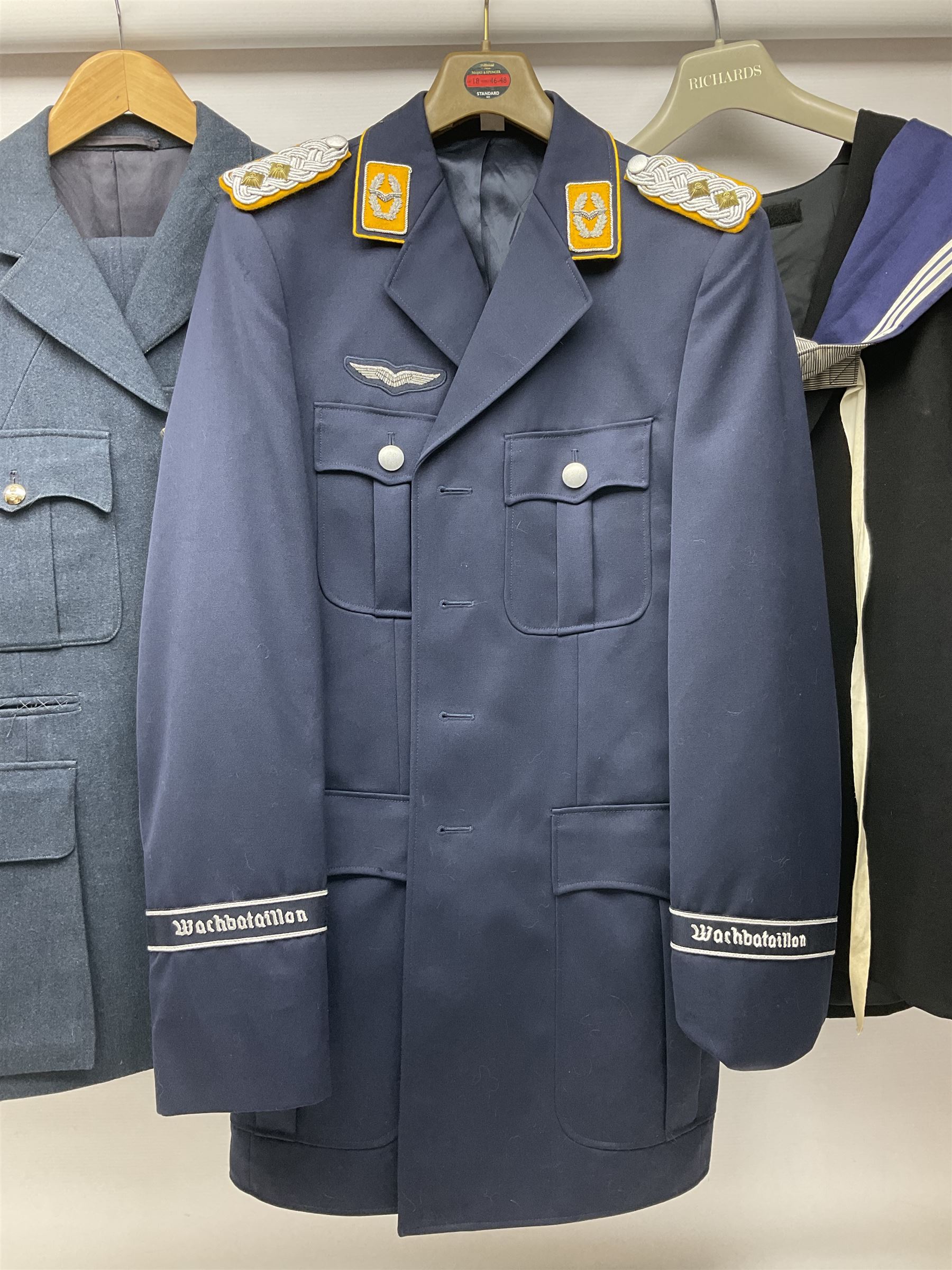 Five military uniforms comprising German Wachbataillon tunic, RASC No.2 dress tunic dated 1963, RAF tunic and trousers dated 1974, RE No.1 tunic and RN Seamans jumper Class II (5)