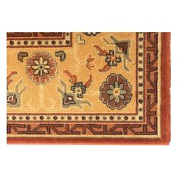 Late 20th century Royal Keshan 'Agra' hand-knotted wool rug, terracotta ground with central floral medallion and scrolling vines, enclosed by a cream border with repeating floral motifs