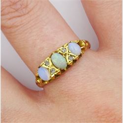 Early 20th century three stone opal ring, with diamond accents set between, Chester 1914
