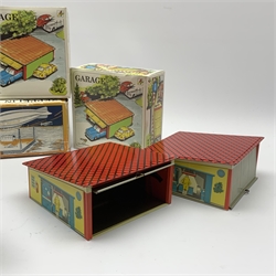 Three modern tin-plate toys comprising Schylling Aluminium Airship L24cm; and two Kovap garages with up-and-over doors, all boxed (3)
