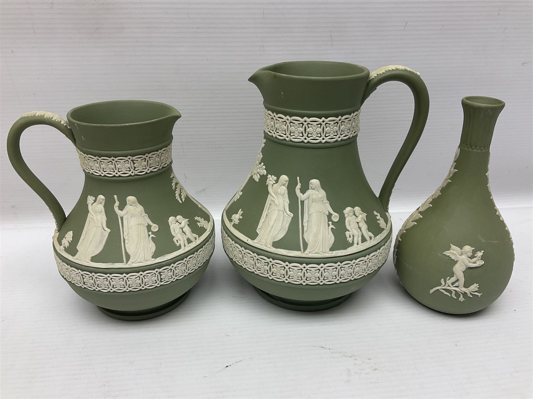 Collection of  Wedgwood green Jasperware, to include large jug, vases, trinket dishes, etc together with two teal Jasperware vases 