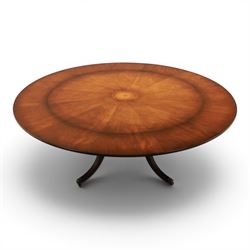 Bevan Funnell Reprodux - Regency design mahogany extending dining table, circular radial veneered top with central fan inlaid patera, on turned pedestal with four reeded downswept supports terminating in brass caps and castors, with six addtional leaves in a fitted storage case